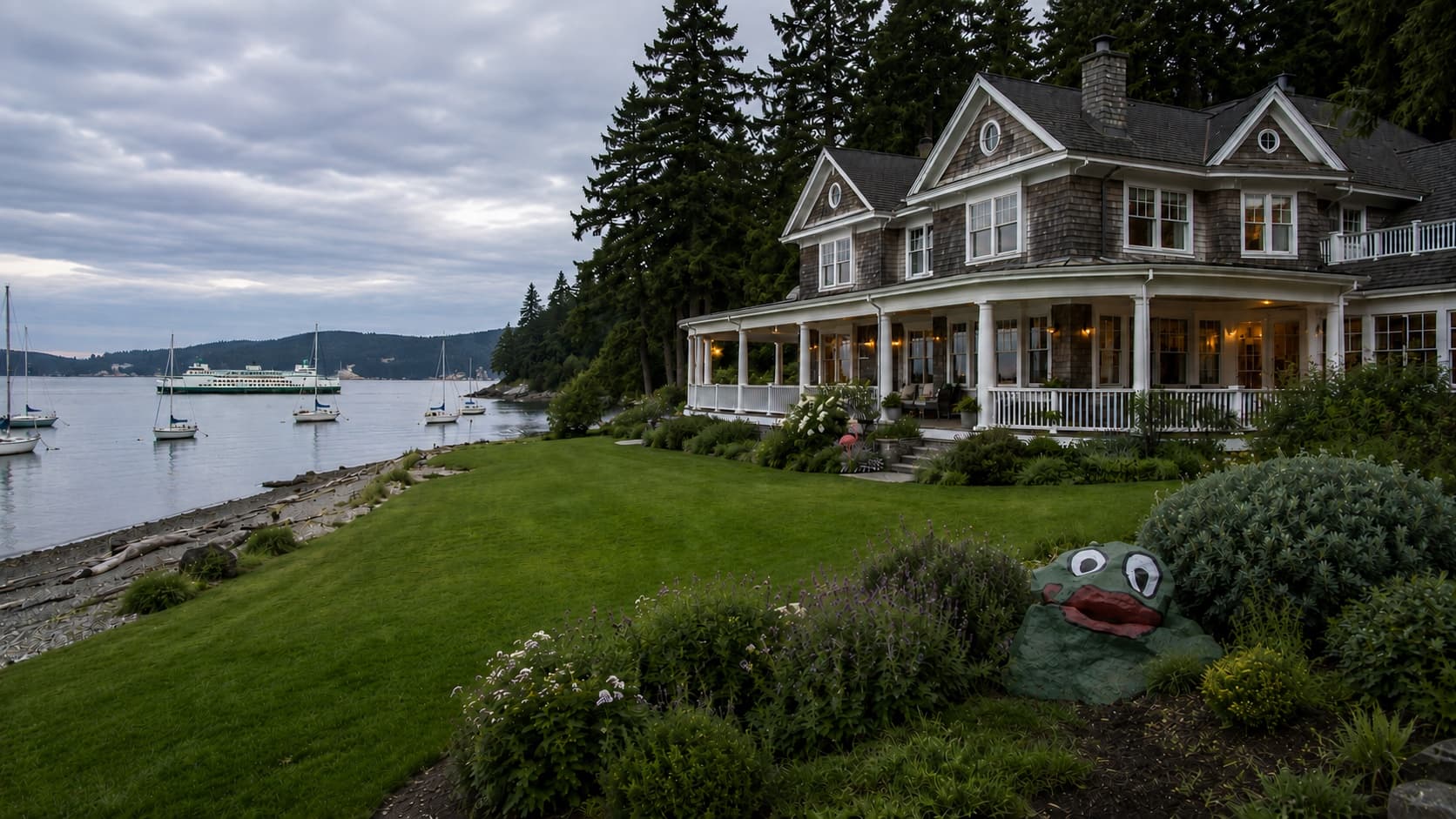 Waterfront home and sailboats along the Bainbridge Island shoreline